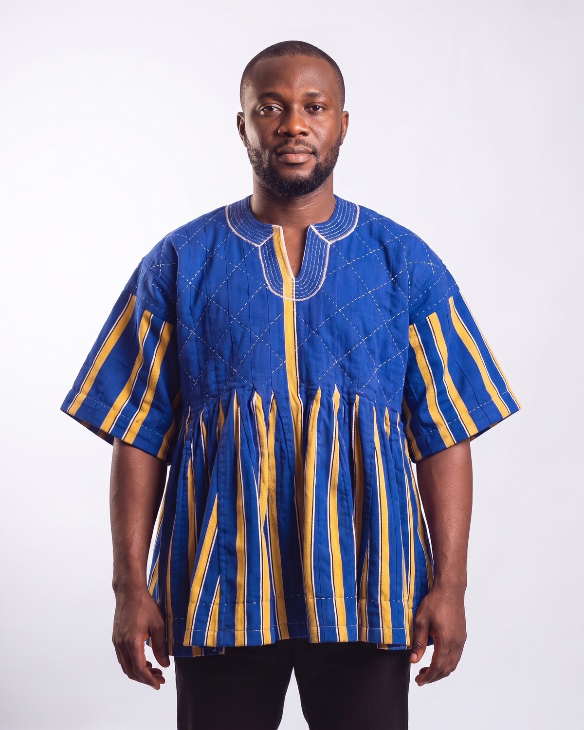 Man wearing a hand-woven blue and gold fugu smock