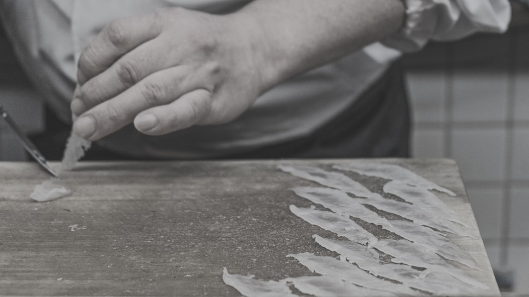 Artisan weaving an authentic handwoven Ghana fugu smock on a traditional narrow-band strip loom in northern Ghana